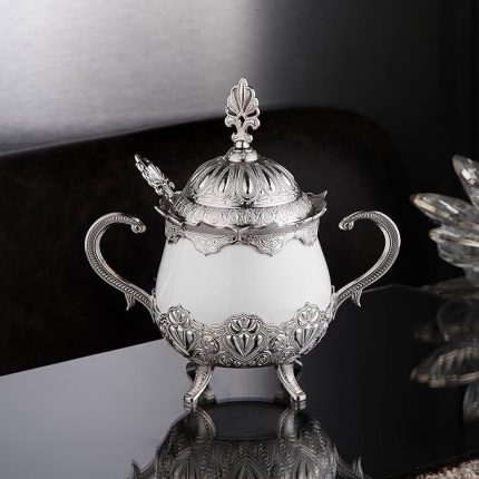 A Silver and White Sugar Serving Bowl