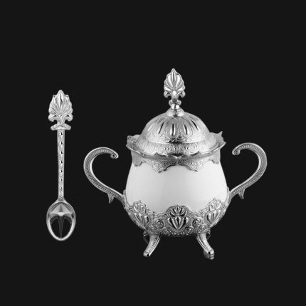 A Silver and White Sugar Serving Bowl