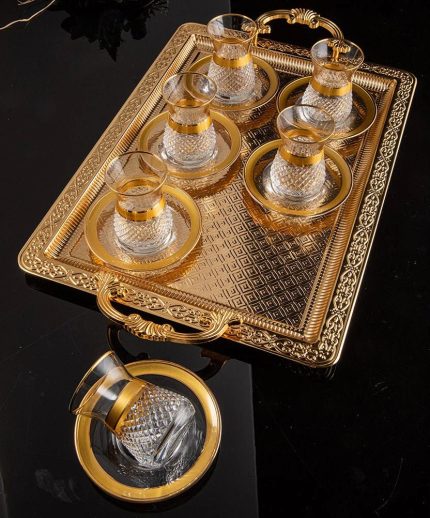 tea set with saucers with gold rim.