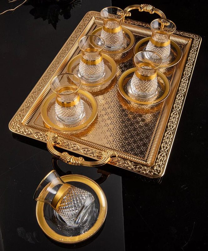 tea set with saucers with gold rim.